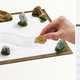 Illustration for article titled Nothing Could Be More Relaxing Than a Zen Garden Puzzle That Becomes a Zen Garden